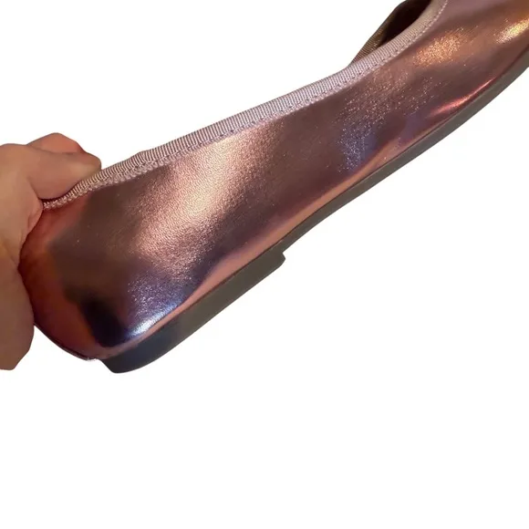 Cushionaire Pink Metallic ballet flats with bow accent.