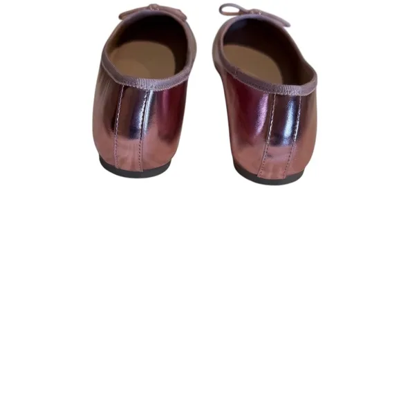 Cushionaire Pink Metallic ballet flats with bow accent.