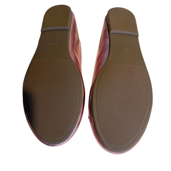 Cushionaire Pink Metallic ballet flats with bow accent.