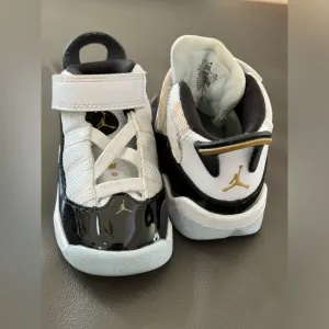 Jordan Toddler black,‎ white and gold sneakers 6C