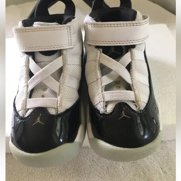 Jordan Toddler black,‎ white and gold sneakers 6C