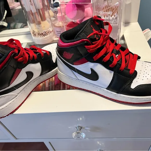 Nike Black and White Sneakers with Mid-Top Design