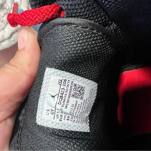 Nike Black and White Sneakers with Mid-Top Design