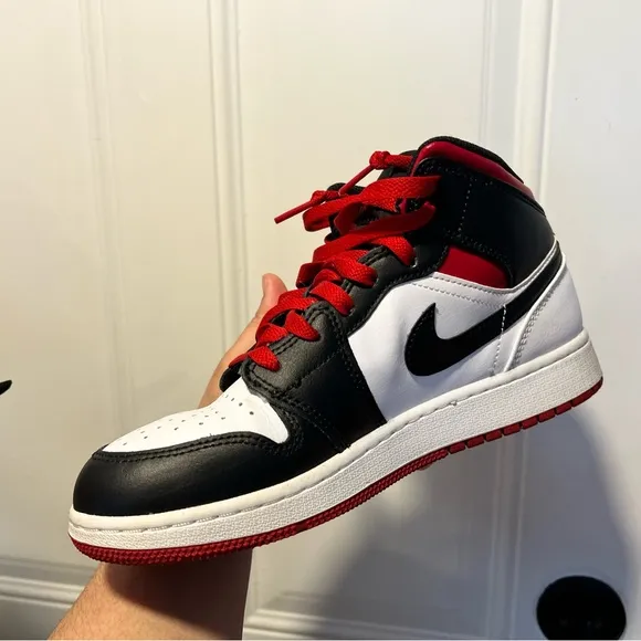 Nike Black and White Sneakers with Mid-Top Design