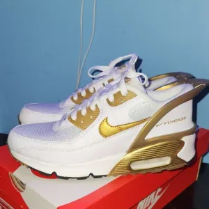 Nike Gold and White Sneakers with Air Max Design