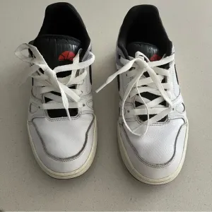 Nike White and Black Low-Top Sneakers with Red Accent
