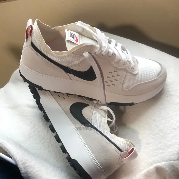 Nike White and Black Sneakers with Minimalist Design
