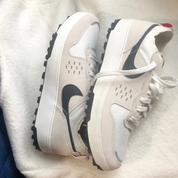 Nike White and Black Sneakers with Minimalist Design