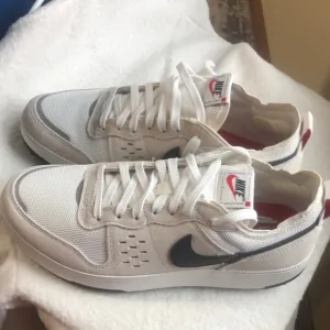 Nike White and Black Sneakers with Minimalist Design