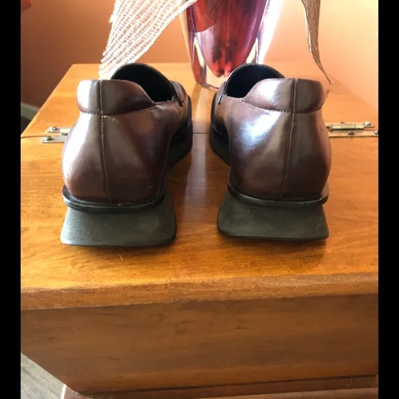 PRADA chocolate brown slip-on leather loafers